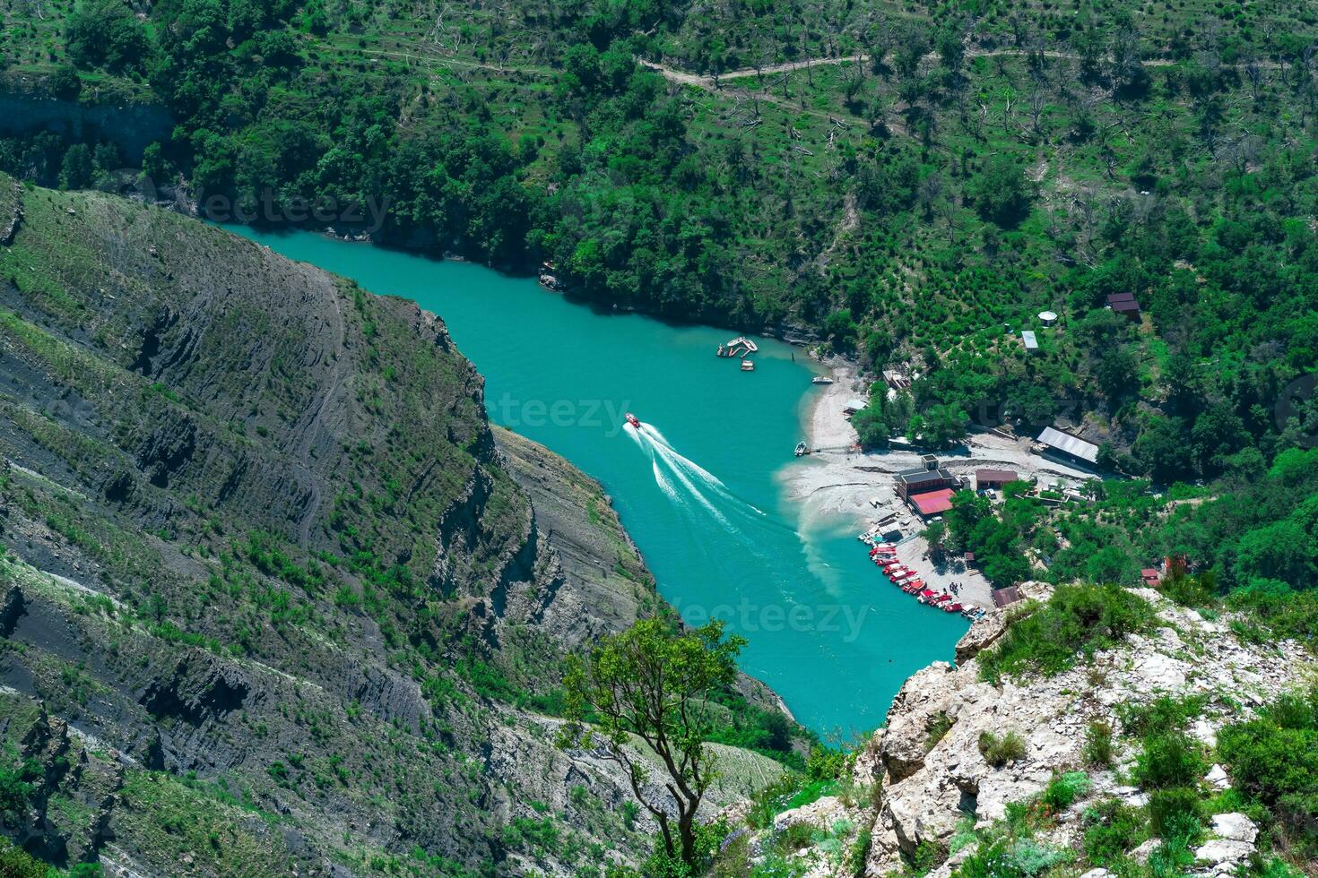 top view of the mountain river Sulak in Dagestan with boat jetty photo