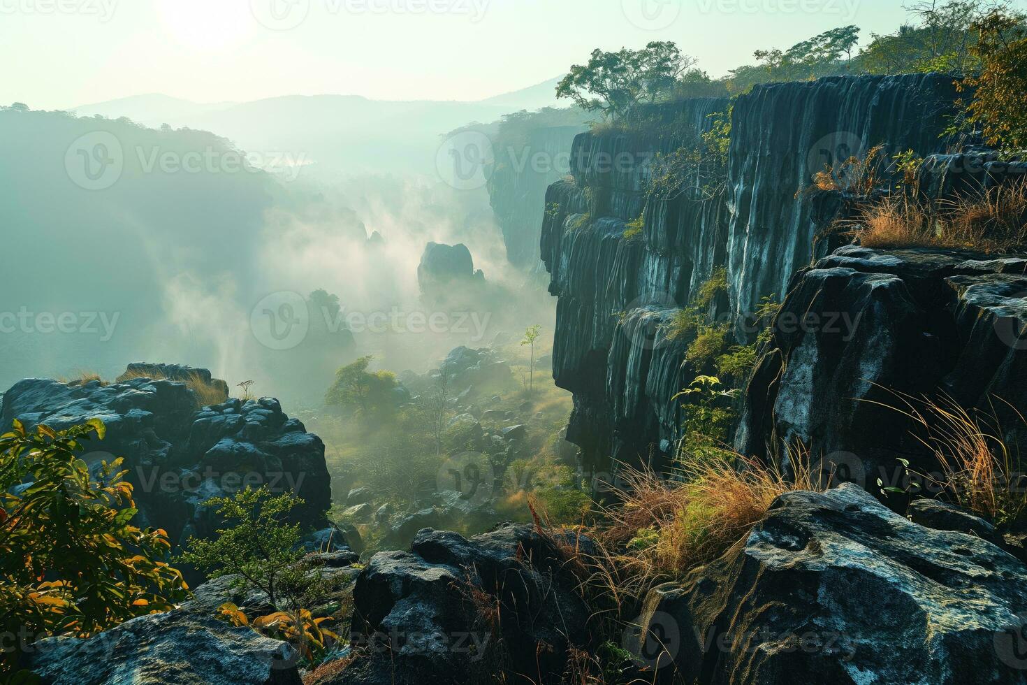 AI generated path in a mountainous area overlooking a beautiful misty valley in the morning rays photo