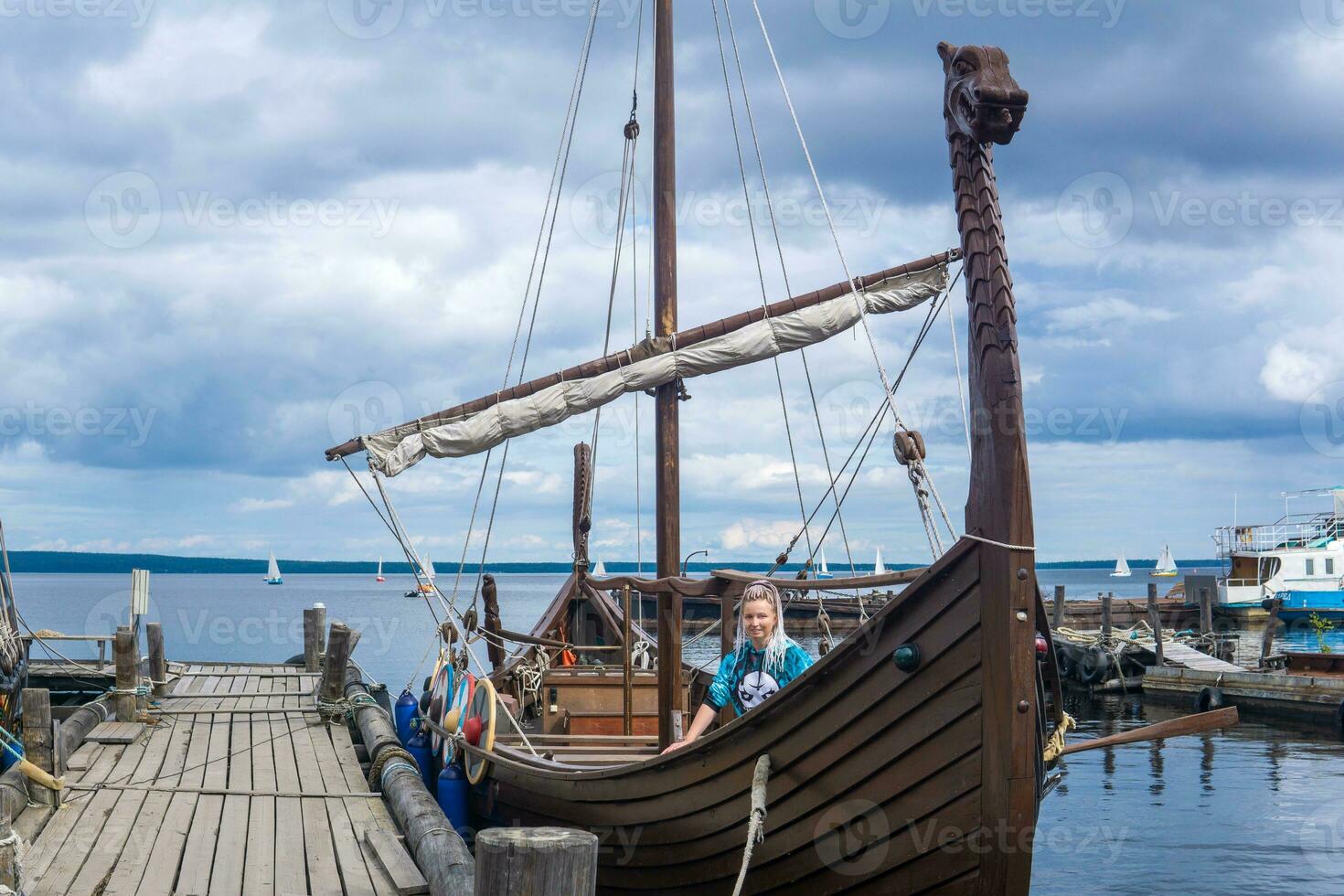 tourist aboard a modern replica of ancient viking longship photo