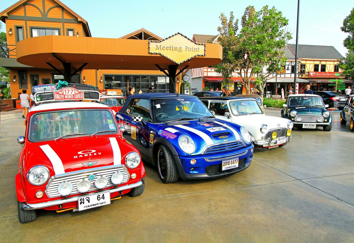 Ayutthaya, Thailand - December 6, 2023 Many colorful New and Old Mini cooper car parked at meeting point. Transportation, Colorful vehicle and Small car concept. photo