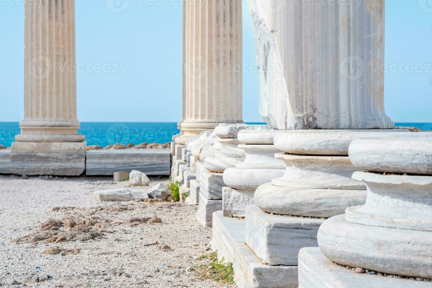 fragment of the colonnade of the destroyed temple of Apollo in Side on the background of the sea photo