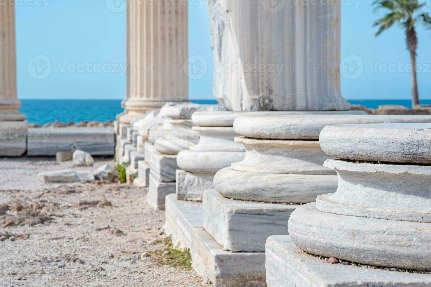 fragment of the colonnade of the destroyed temple of Apollo in Side on the background of the sea photo