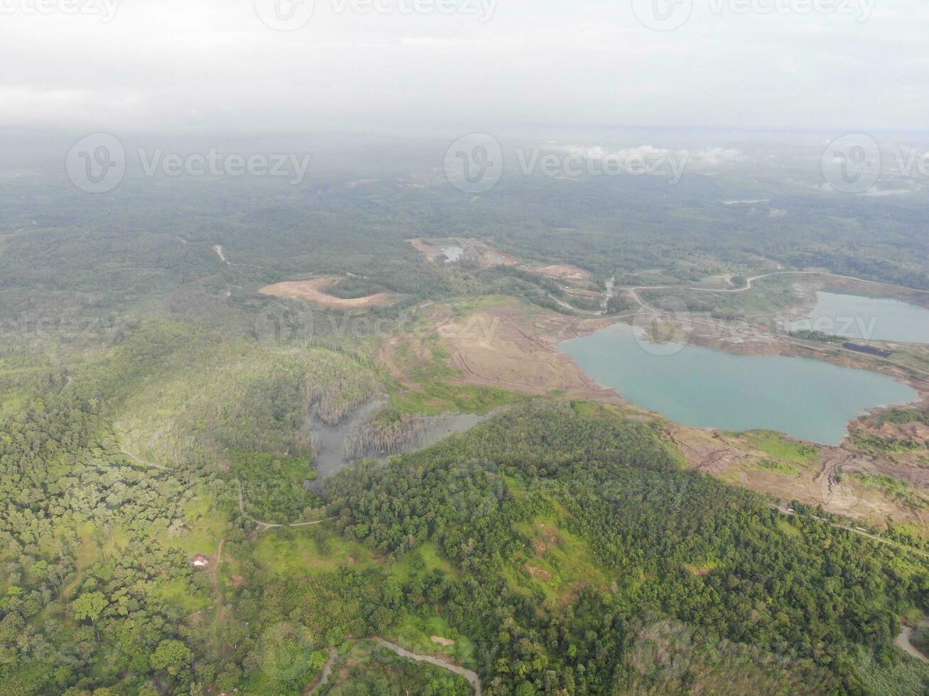 a view of the mountains from a hillside. Serelo Hill is located in Perangai Village, Lahat regency, and it becomes one of popular landmark in Lahat regency. photo