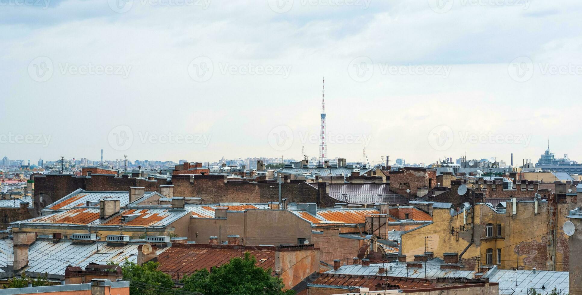 view of the roofs of the historical center of St. Petersburg on a cloudy day photo