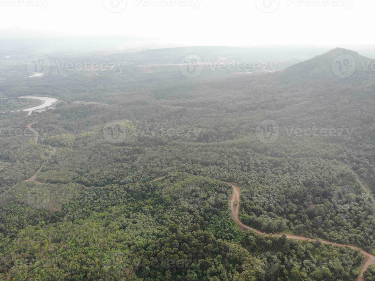 a view of the mountains from a hillside. Serelo Hill is located in Perangai Village, Lahat regency, and it becomes one of popular landmark in Lahat regency. photo