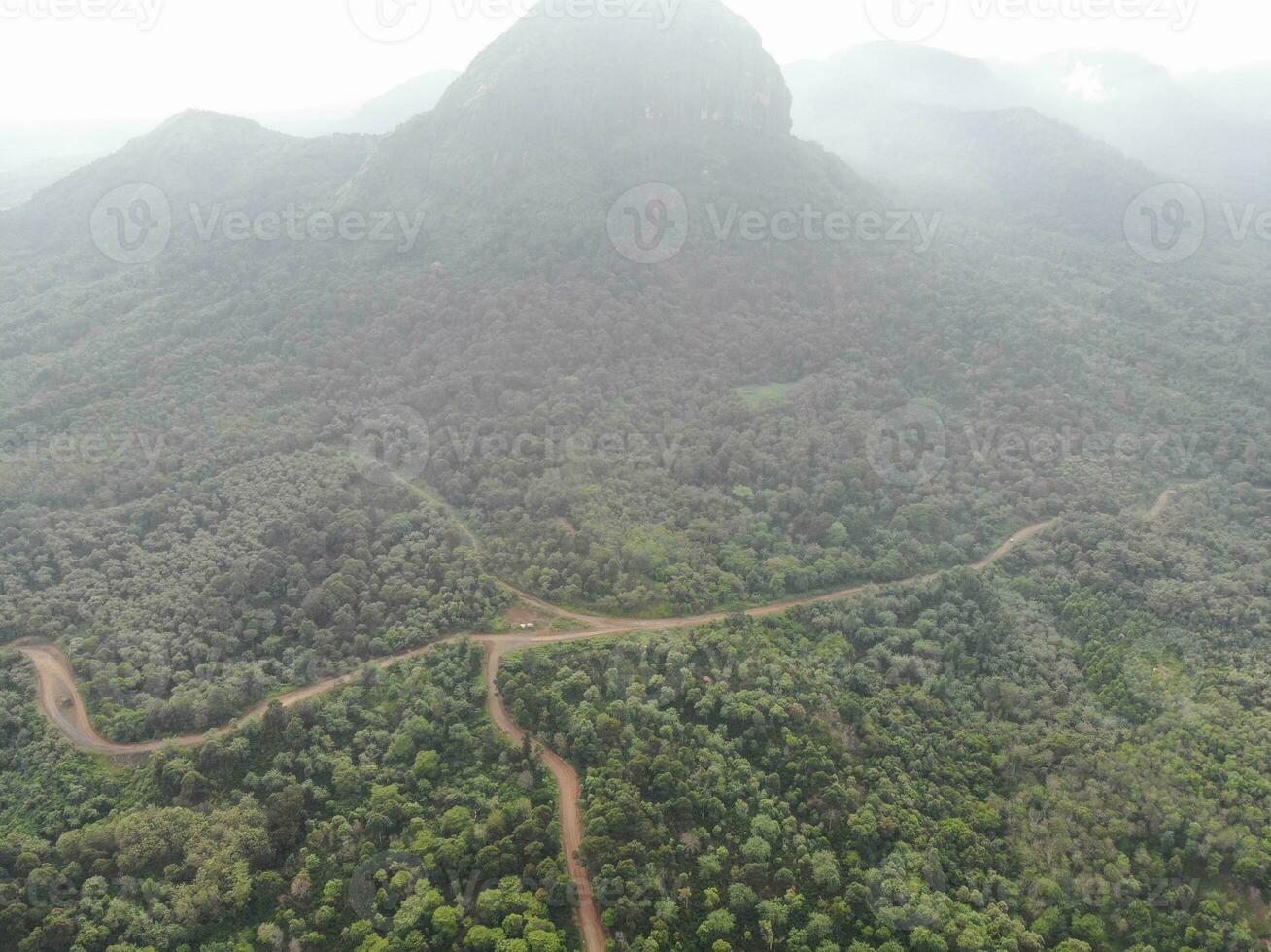 a view of the mountains from a hillside. Serelo Hill is located in Perangai Village, Lahat regency, and it becomes one of popular landmark in Lahat regency. photo