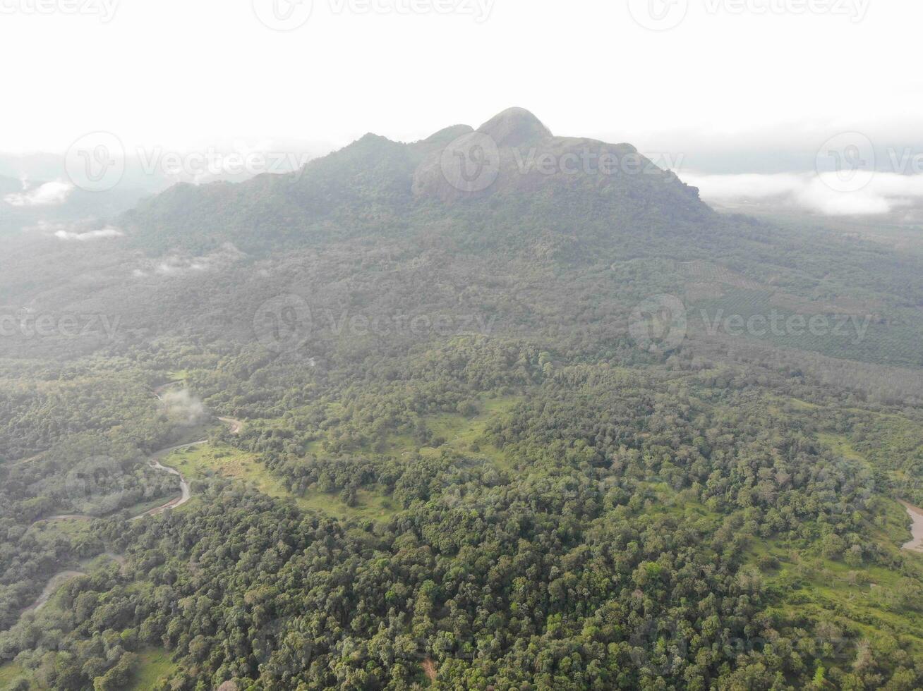 a view of the mountains from a hillside. Serelo Hill is located in Perangai Village, Lahat regency, and it becomes one of popular landmark in Lahat regency. photo