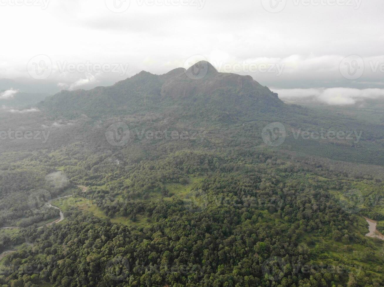 a view of the mountains from a hillside. Serelo Hill is located in Perangai Village, Lahat regency, and it becomes one of popular landmark in Lahat regency. photo