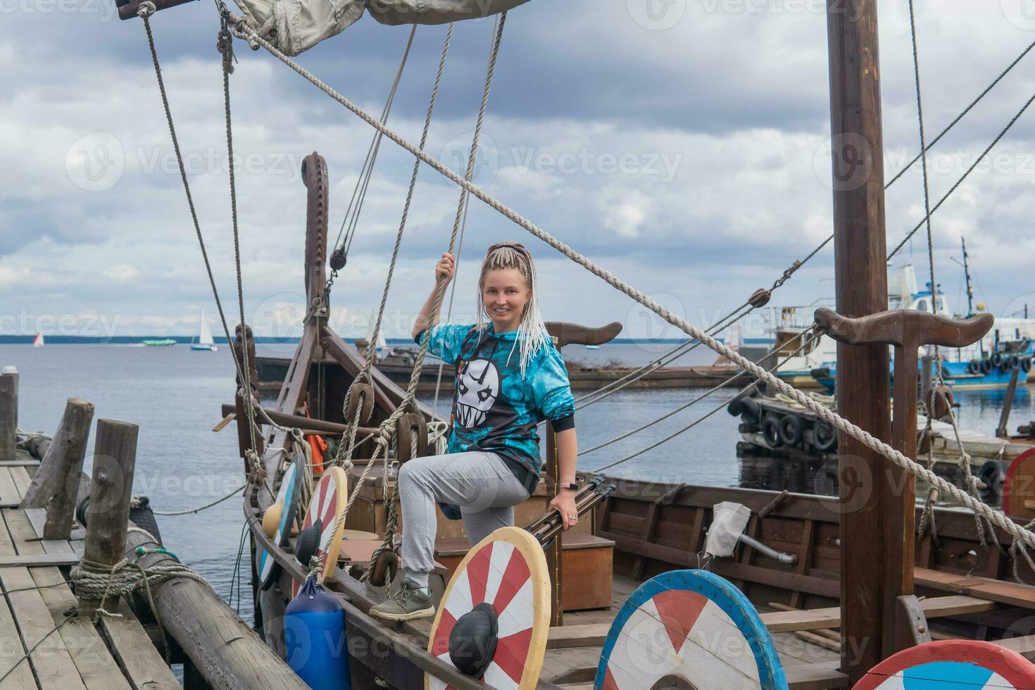 tourist aboard a modern replica of ancient viking longship photo