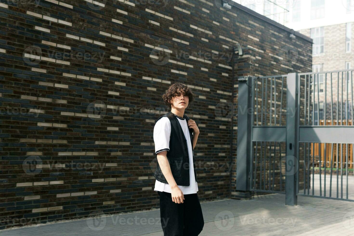 young man on the street against the urban landscape photo