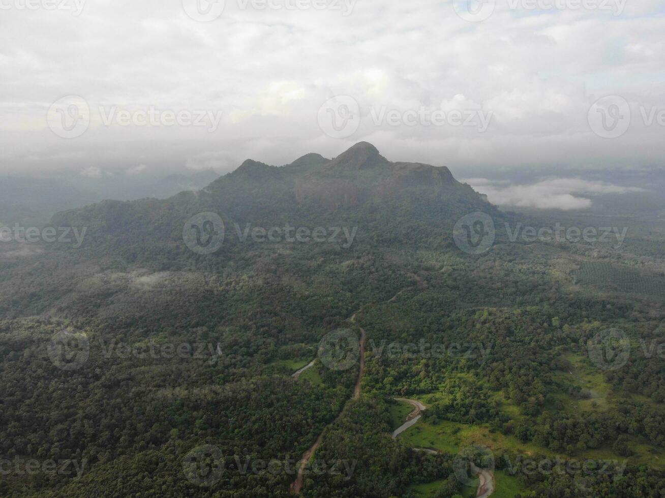 a view of the mountains from a hillside. Serelo Hill is located in Perangai Village, Lahat regency, and it becomes one of popular landmark in Lahat regency. photo