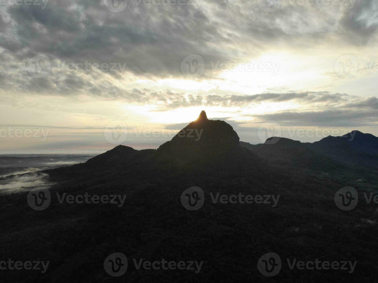 a view of the mountains from a hillside. Serelo Hill is located in Perangai Village, Lahat regency, and it becomes one of popular landmark in Lahat regency. photo