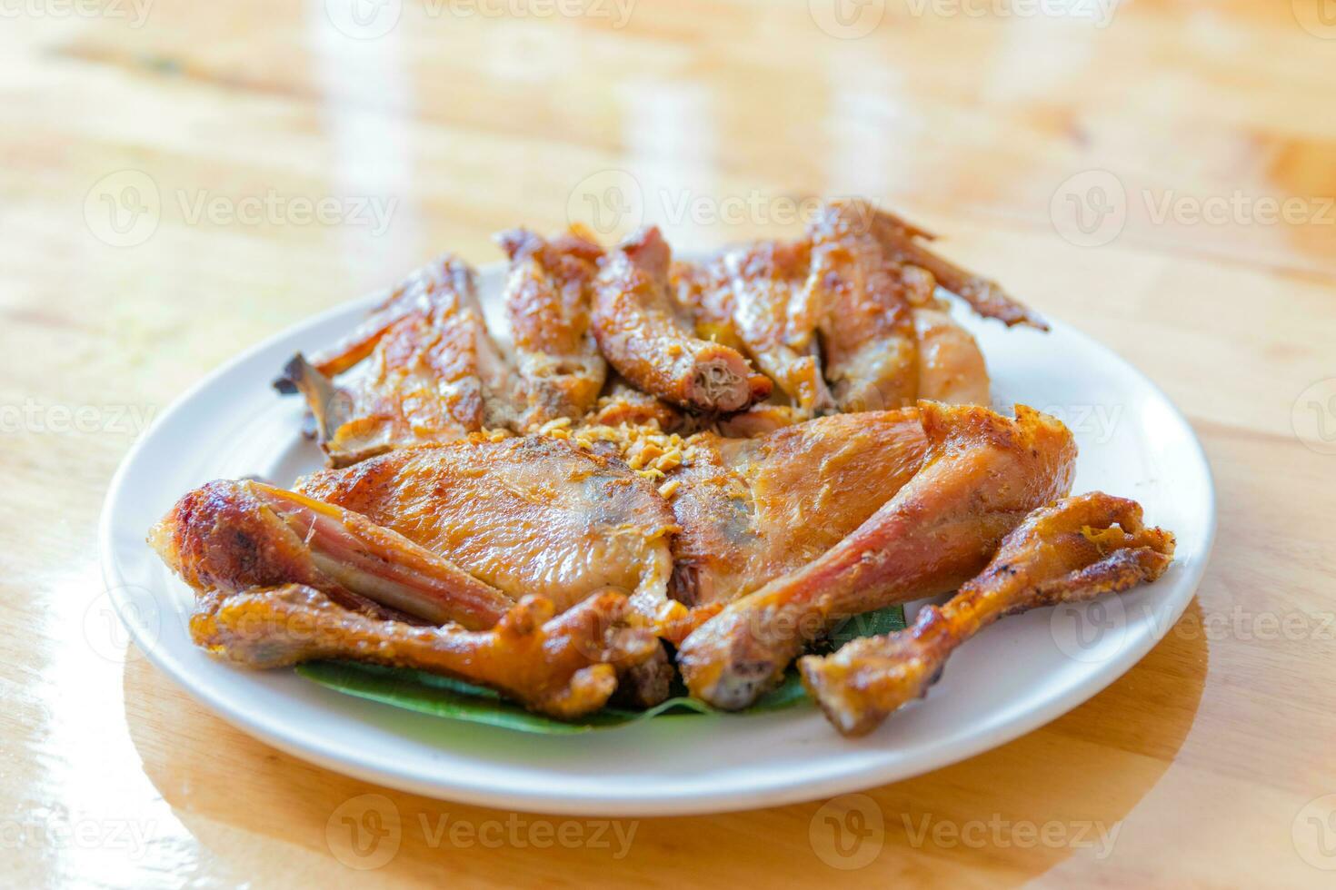 Grilled chicken cut into pieces In white dish photo