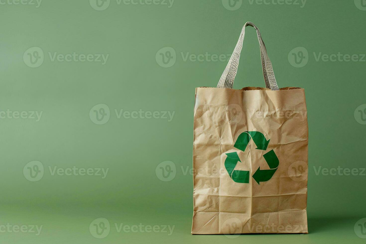 AI generated Paper bag with a recycle symbol on green background photo