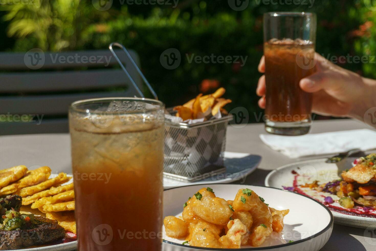 Person drinking ice tea photo