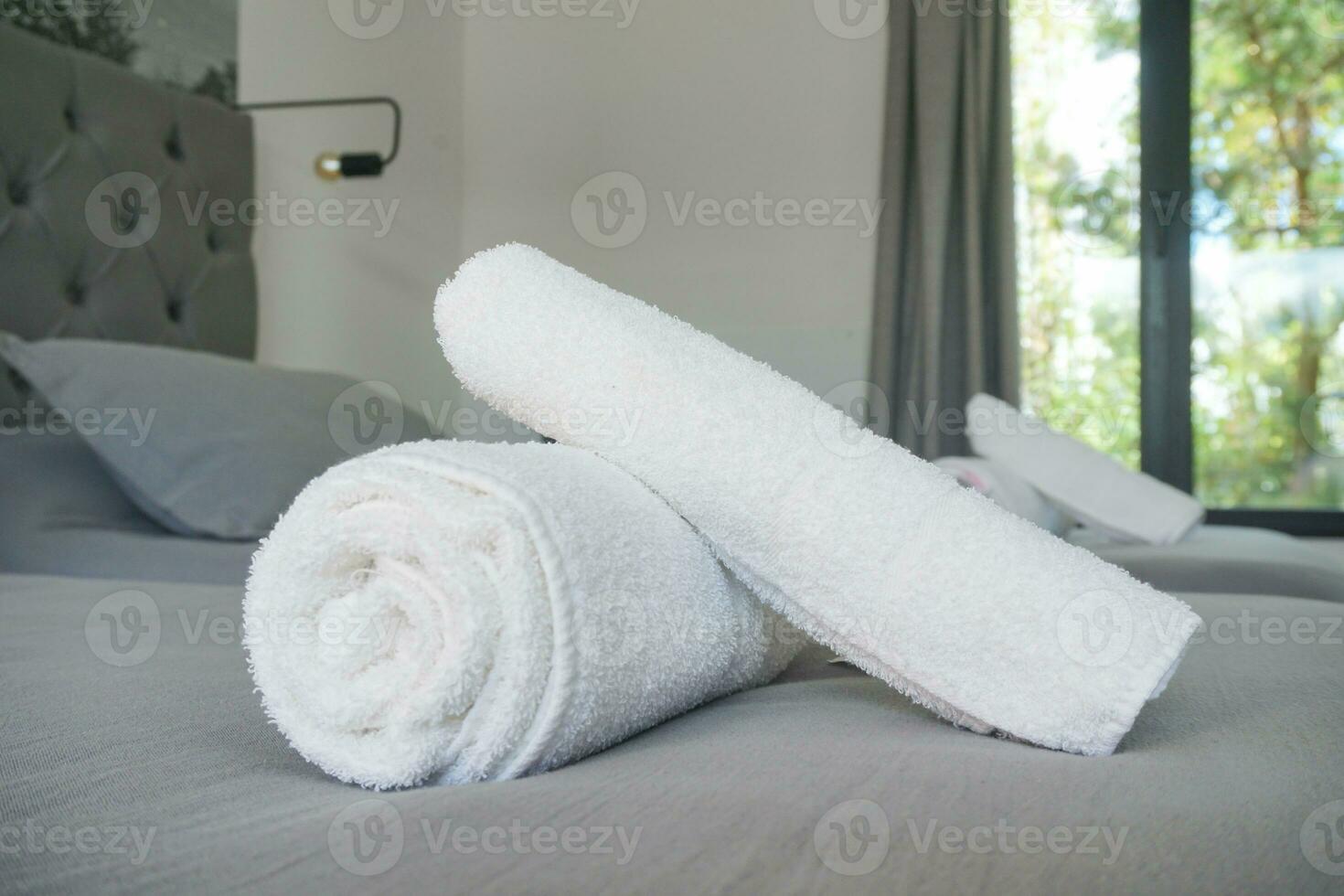 White towels on the bed photo
