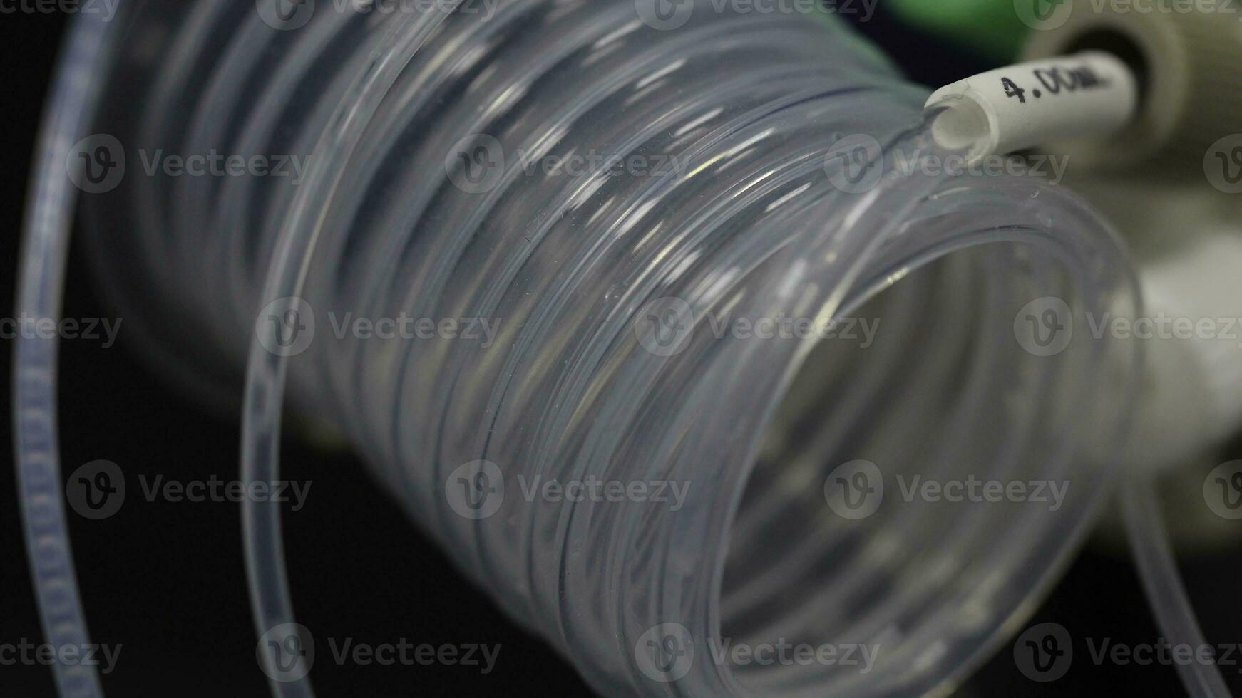 Liquid flows through a transparent pipe. special equipment in the laboratory for fluid transfer. Medical equipment for transfusion. fluid flows on the tube. a blood transfusion close up photo