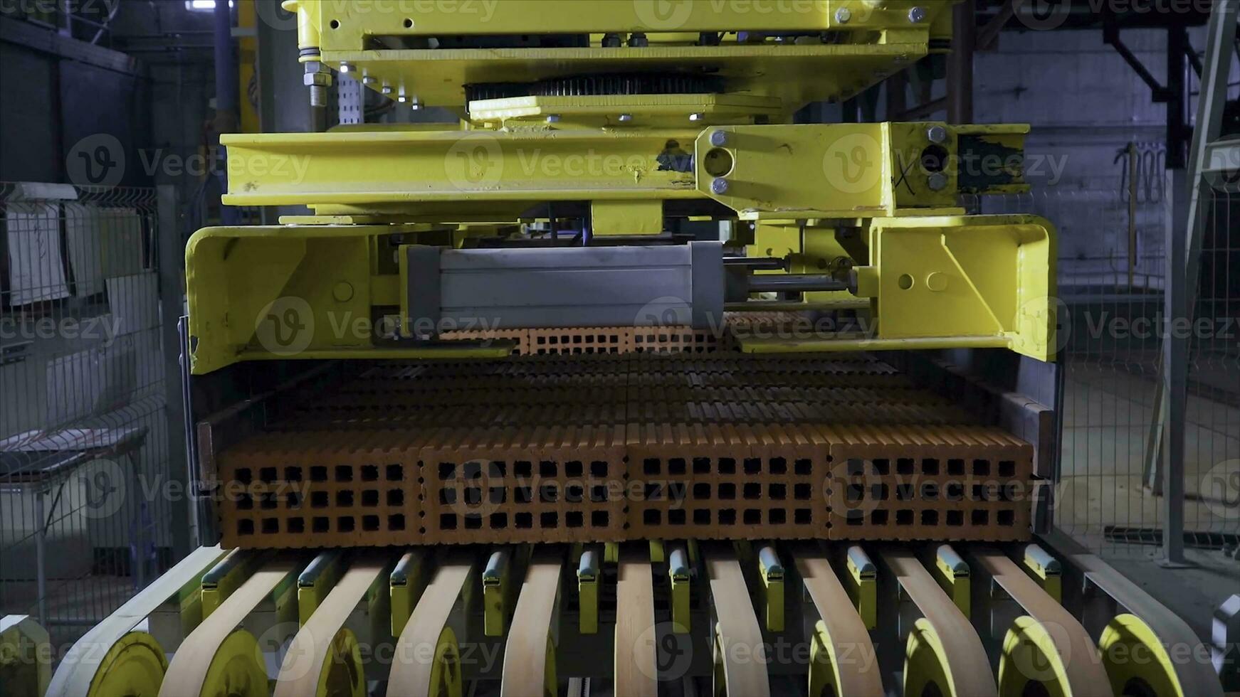 Plant for the production of bricks. Plant for production building material with ready brick, construction industrial. Production of bricks on plant. Workflow, close-up. Many bricks photo