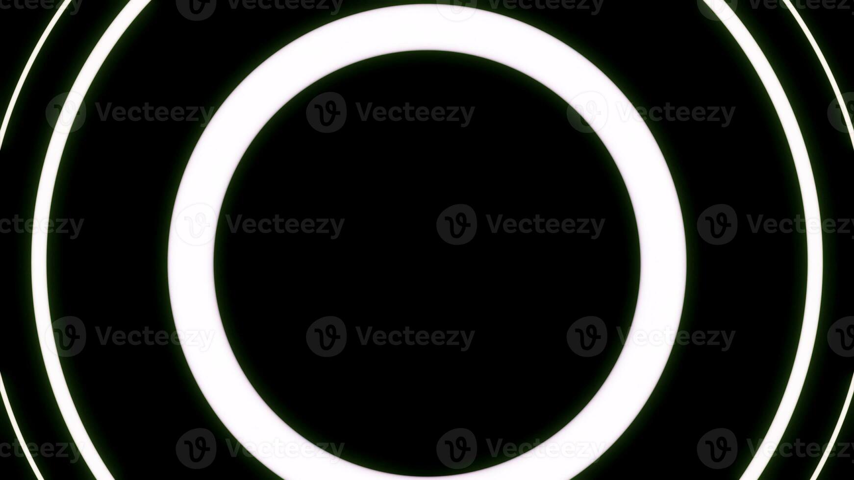 Moving neon circles on a black background. design. Red widening rings like spreading signal. photo