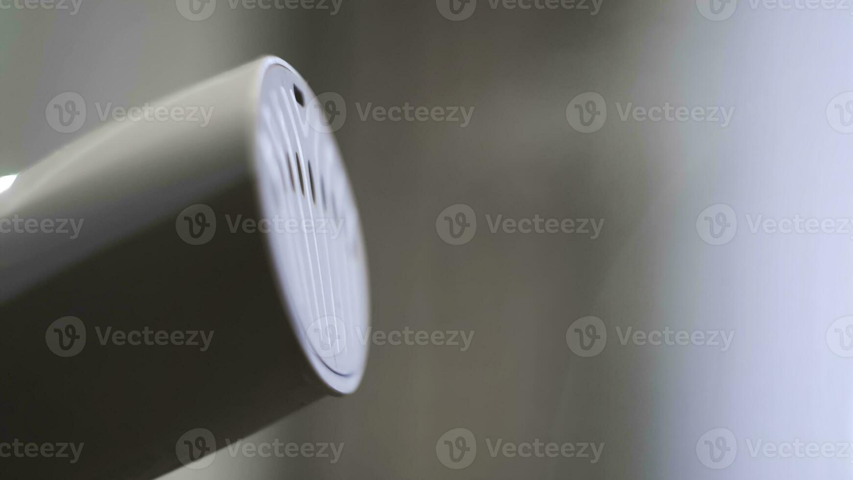 Close-up of garment steamer. Concept. New steamer warms up and sprays out steam. New household technology for smoothing things. Steam for smoothing clothes photo