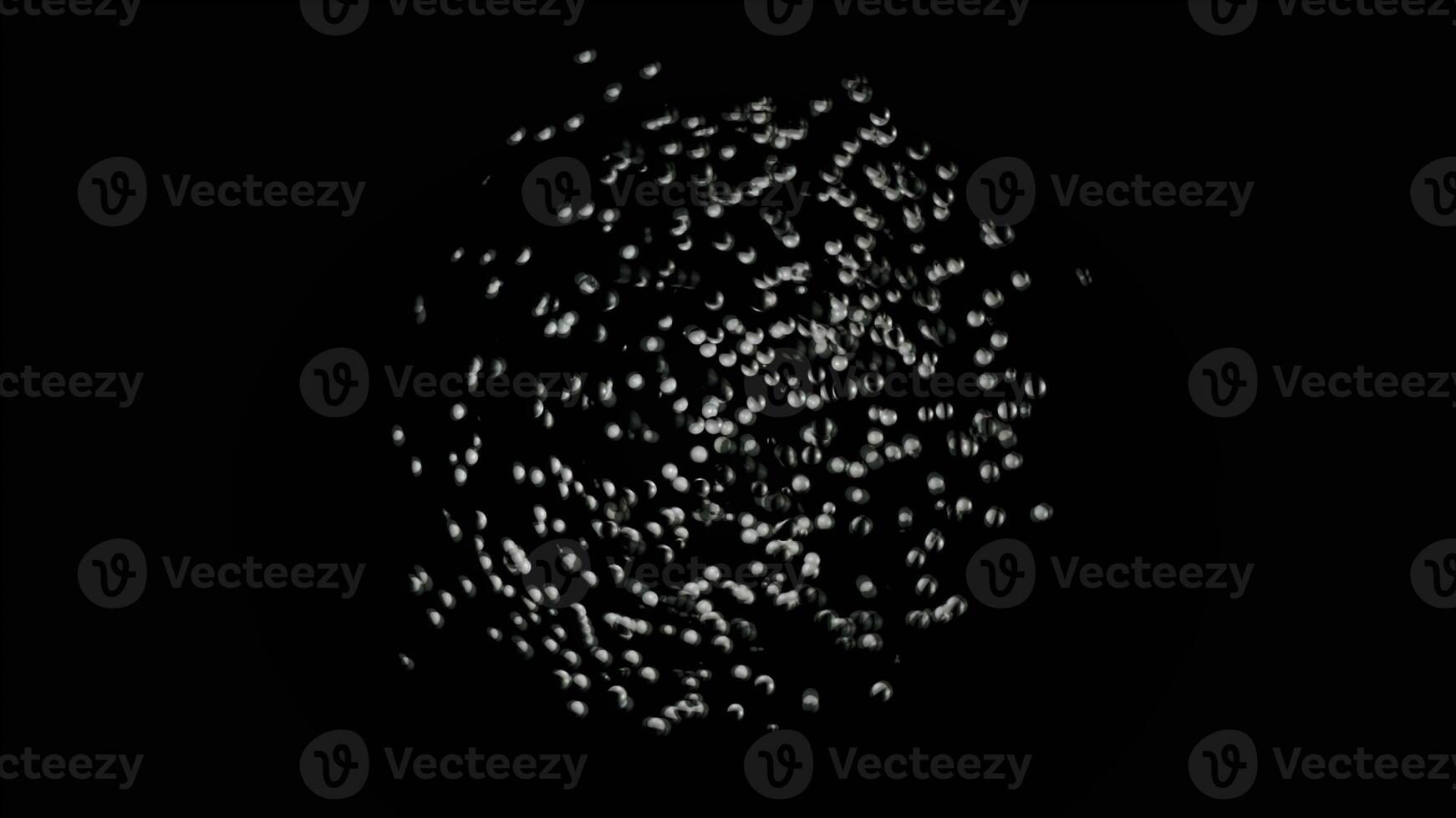 Many white particles moving chaotically with different speed on black background, seamless loop. Animation. Tiny spheres forming a circle, monochrome. photo
