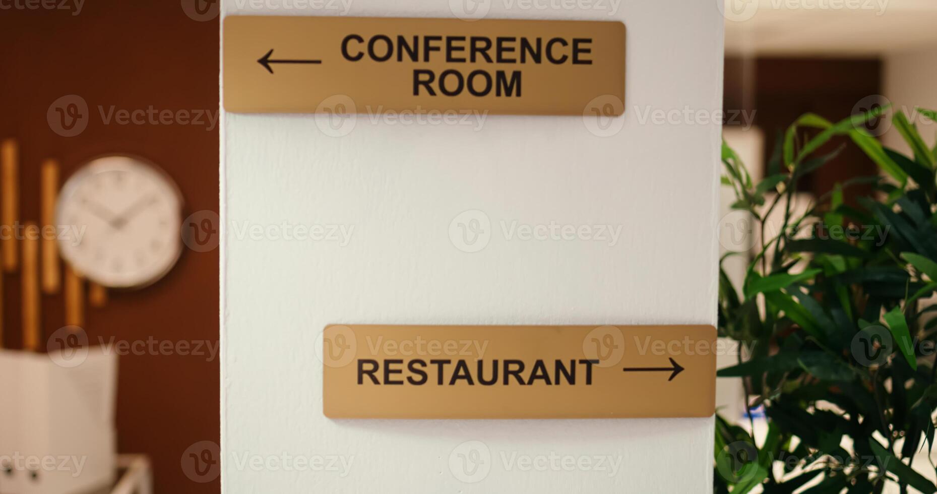 Close up jib shot of conference room, spa center and restaurant amenities signs in empty business hotel lounge interior. Cozy luxurious stylish resort lobby waiting for arriving tourists photo