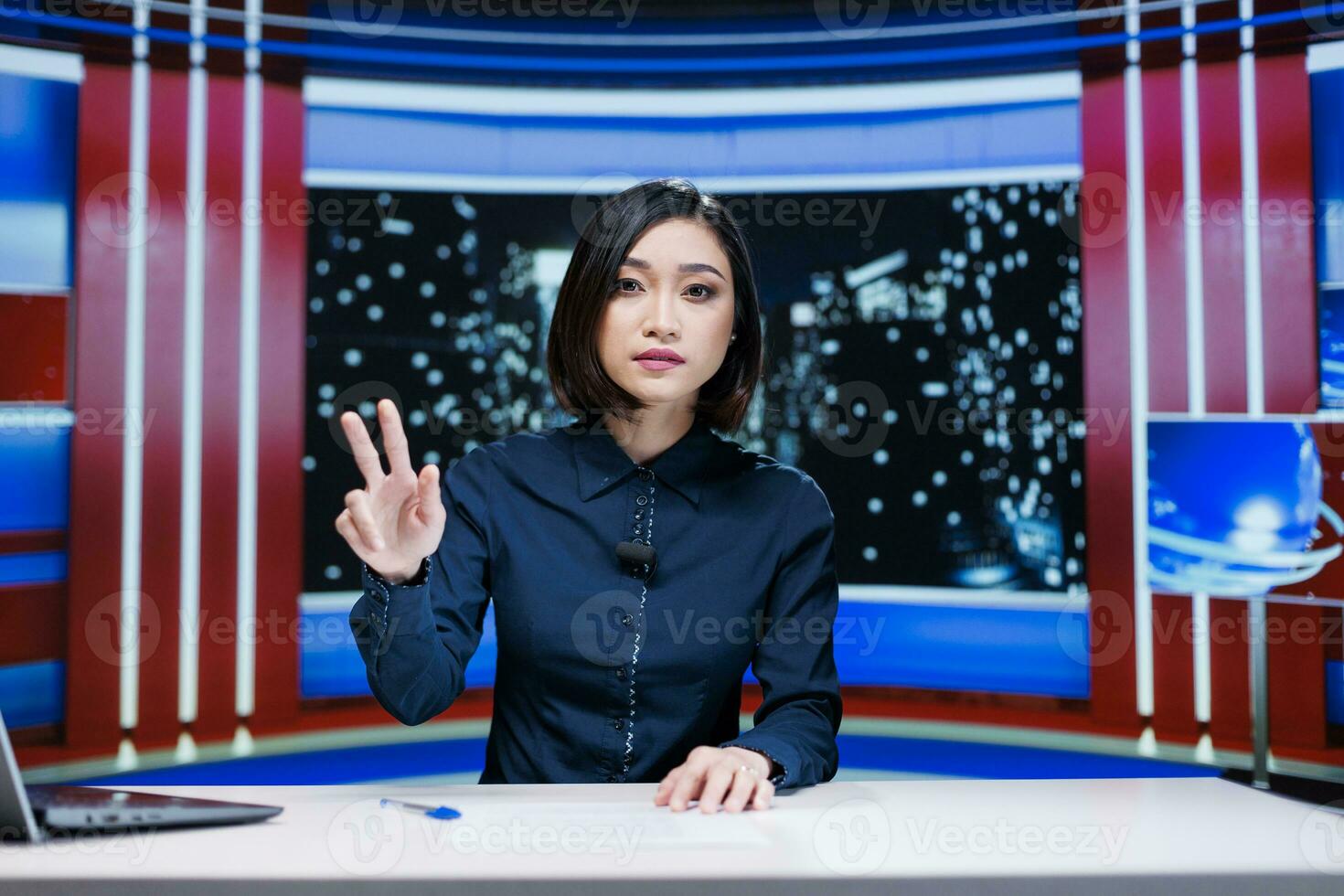 Night show host discussing about news and latest events occuring worldwide, talking about global issues and daily newscast reportage. Woman addressing celebrity drama in studio. photo