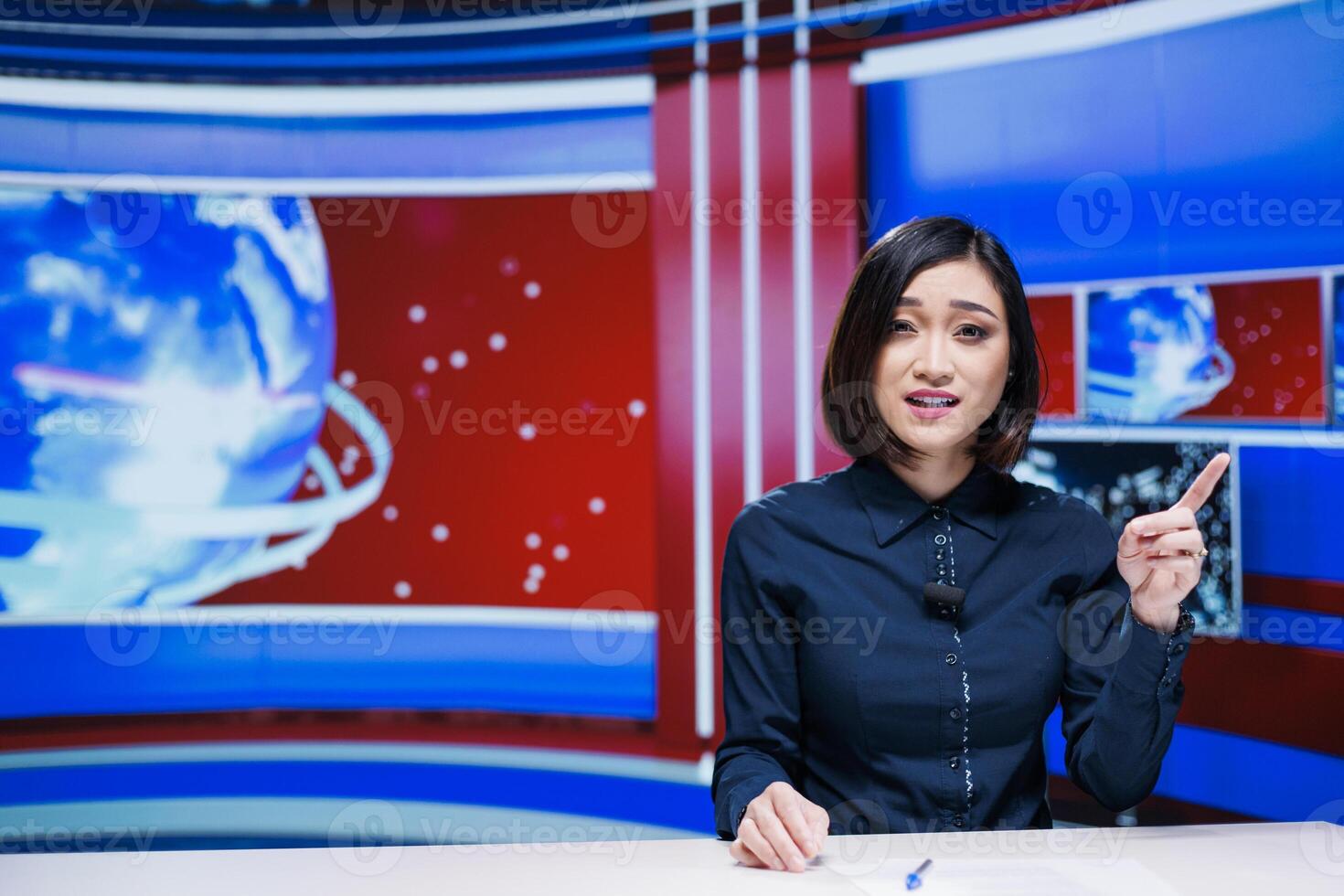 Asian tv host presenting daily news on live broadcast, discussing about latest events happening in the city. Journalist reading media headlines and giving important information to viewers. photo