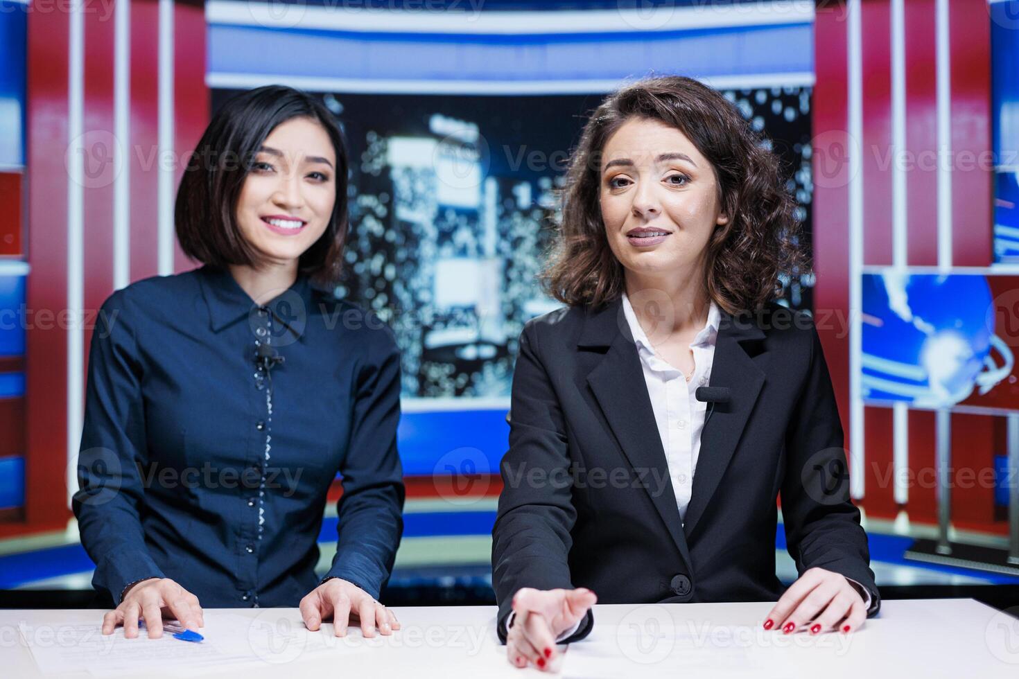 Newscasters team read headlines live on television program, hosting night talk show filled with exclusive media information. Presenters team creating international reportage global issues. photo