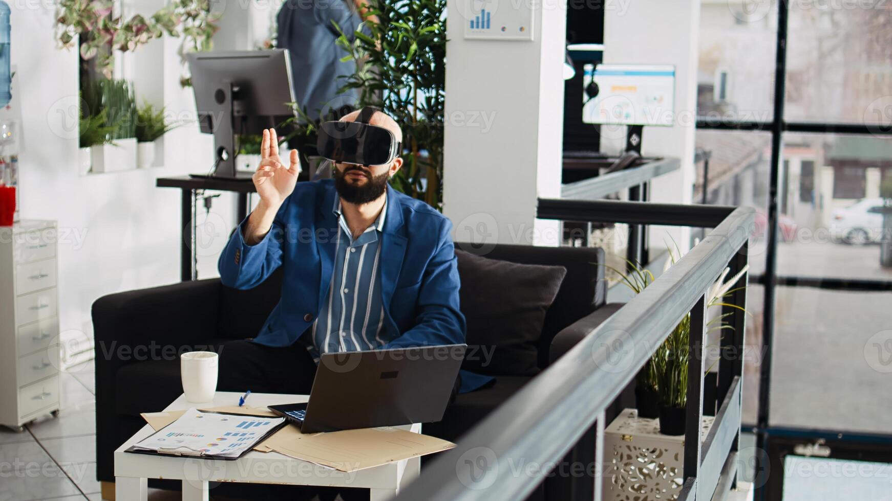 Consultant works with vr headset to create new development project in open space. Middle eastern man using virtual reality artificial intelligence concept, planning leadership strategy. photo
