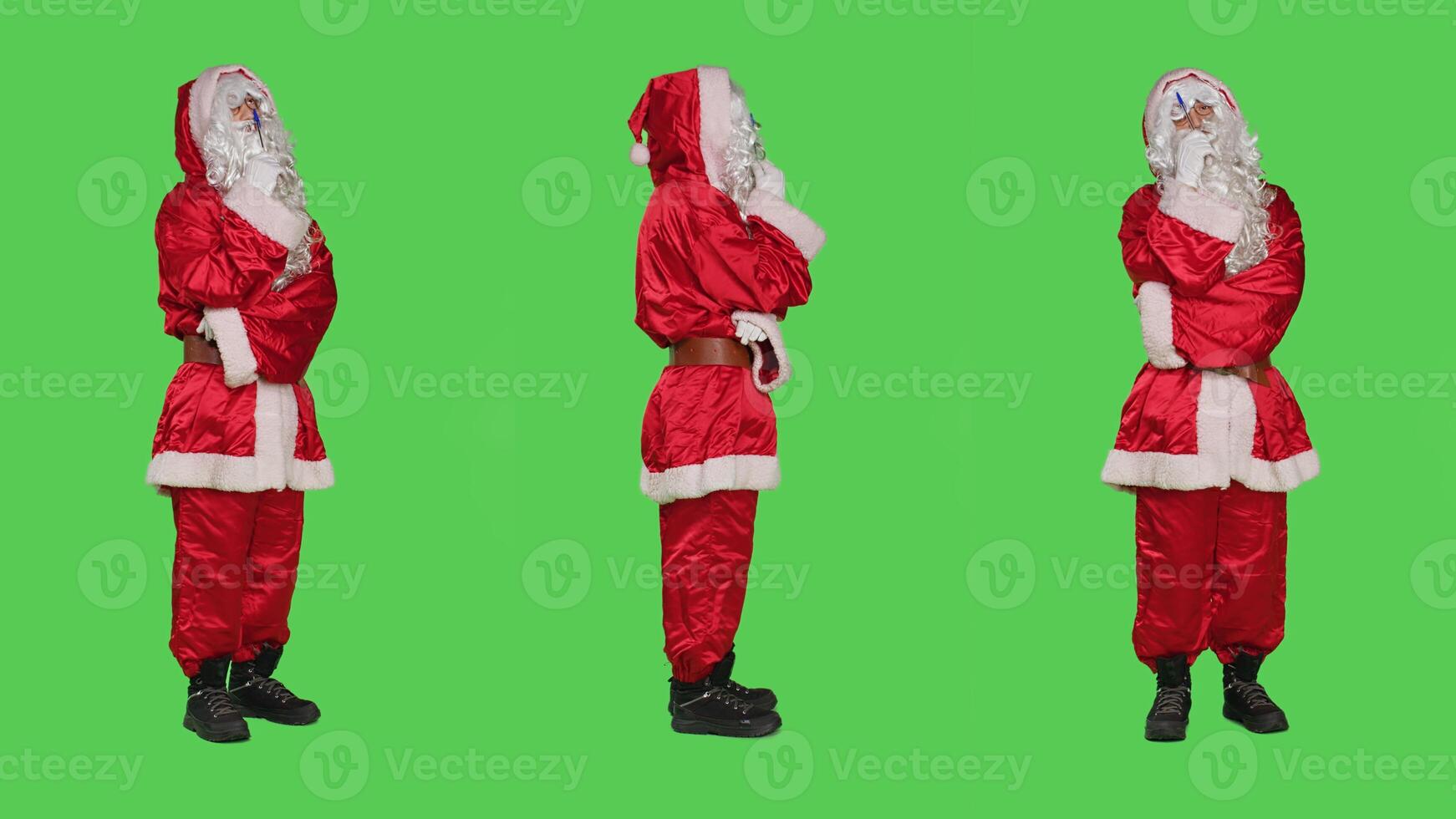 Father christmas thinks about new plan during xmas eve festive celebration, full body greenscreen. Saint nick brainstorm ideas while he is wearing red costume with white beard. photo