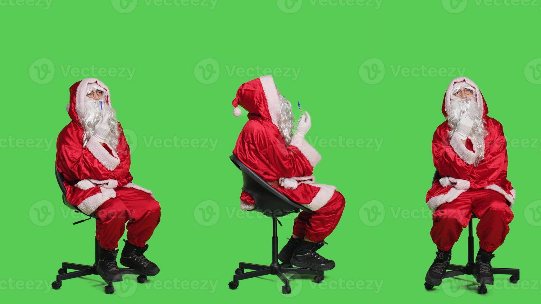 Pensive santa in costume sits on chair, thinking about christmas eve gift ideas over full body greenscreen. Young man acting like saint nick character with white beard, brainstorming. photo