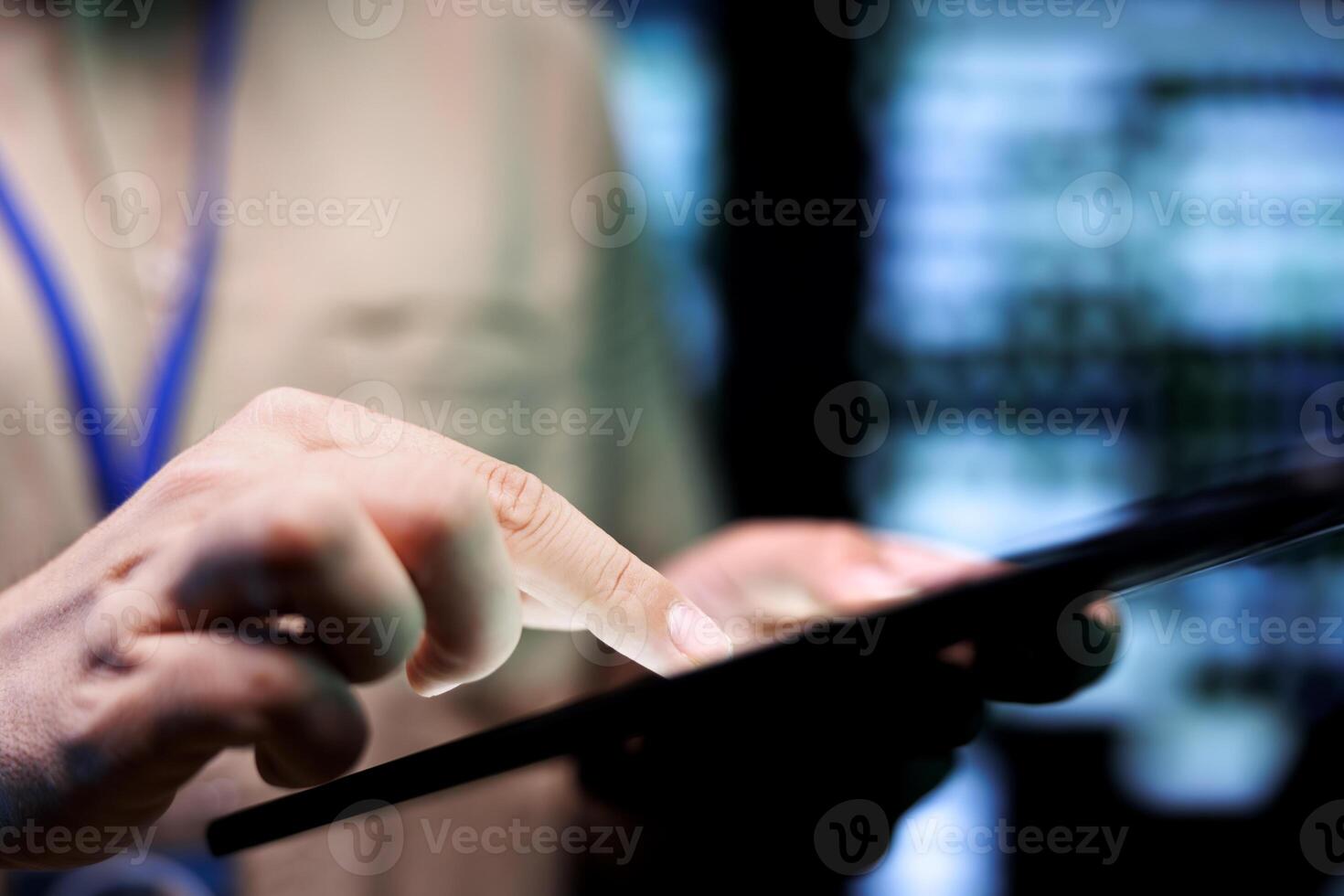 Developer doing thorough system upkeep, imputing data on tablet of required fixing in supercomputers housing advanced data storage hardware supporting complex computing operations, close up photo