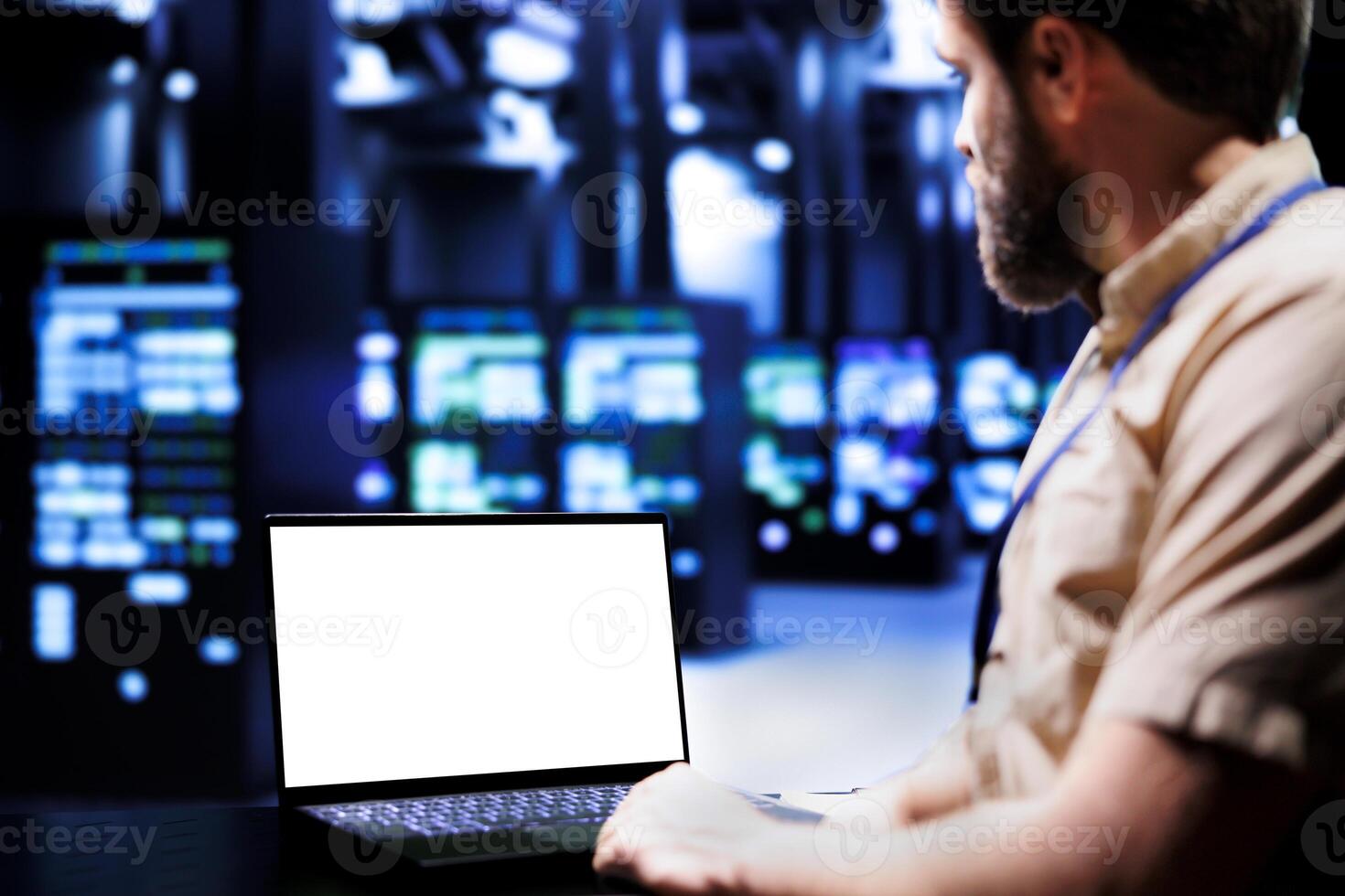 Expert using mock up laptop to evaluate supercomputers with high computing power enabling server room to support demanding applications, including virtual reality and video rendering workloads photo