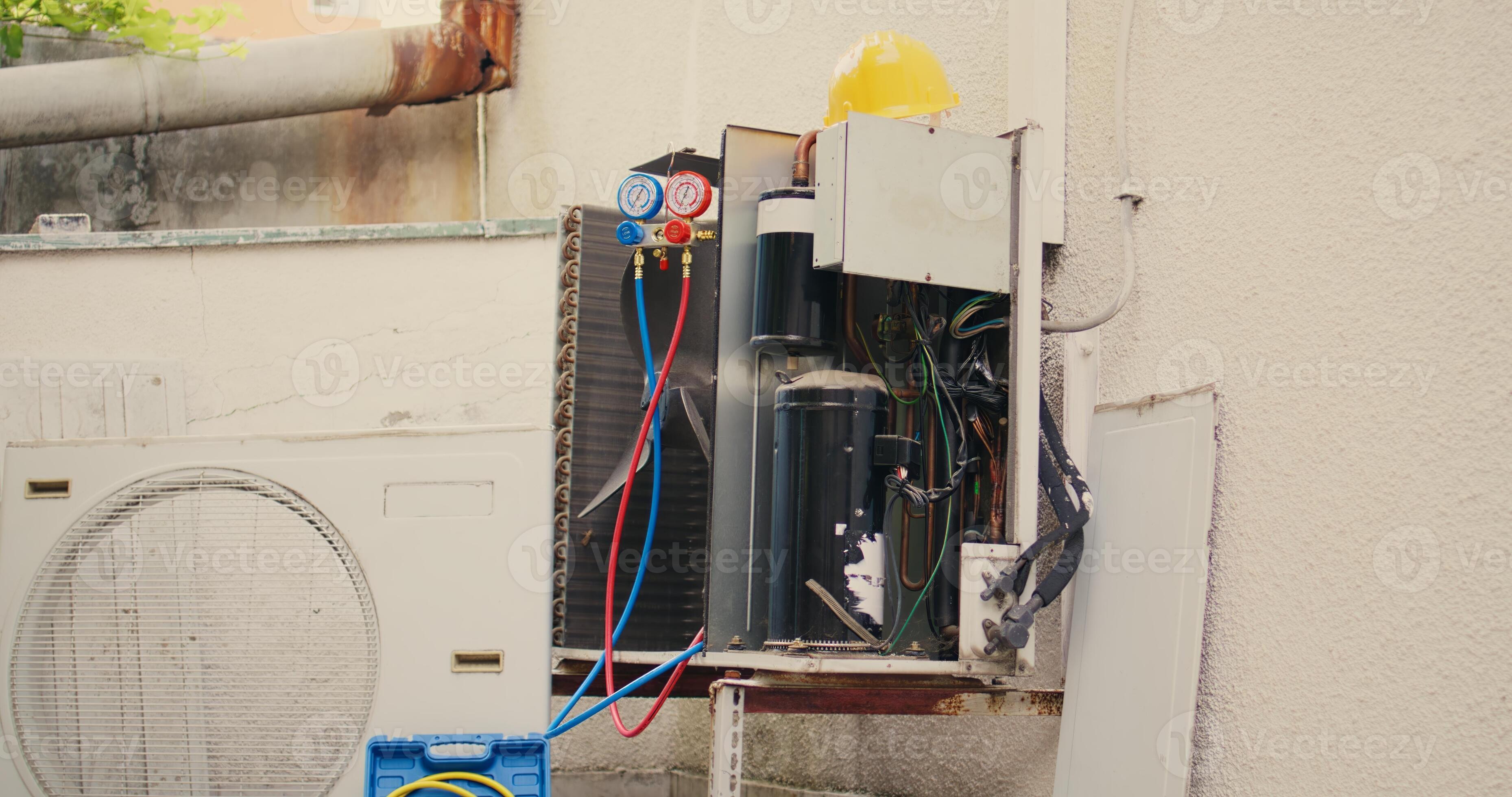 Handheld camera shot of defective air conditioner in need of fixing