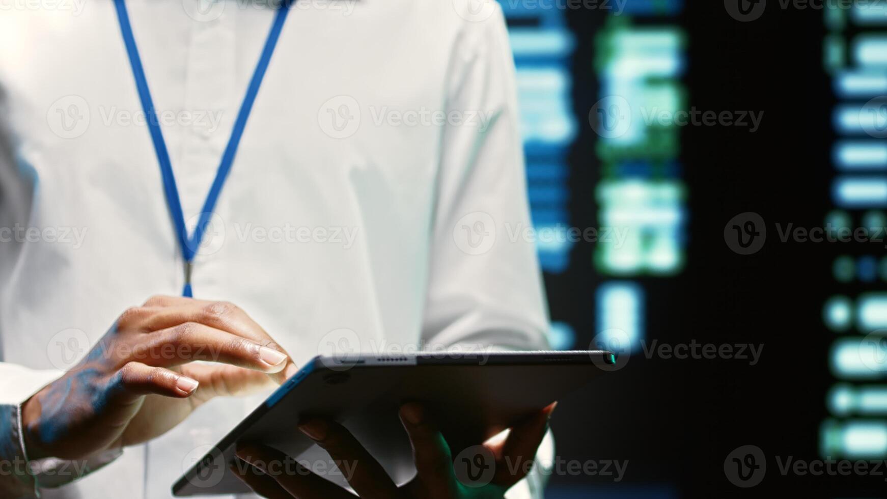 Electrician in server hub walking through supercomputers used for computationally intensive tasks such as scientific simulations or 3D rendering. Wireman doing annual equipment checkup photo