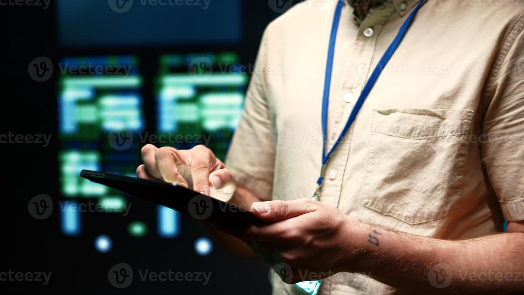Meticulous technician doing checkup, inputing data on tablet of needed fixes in server hub housing advanced data storage infrastructure supporting critical IT workloads, close up photo