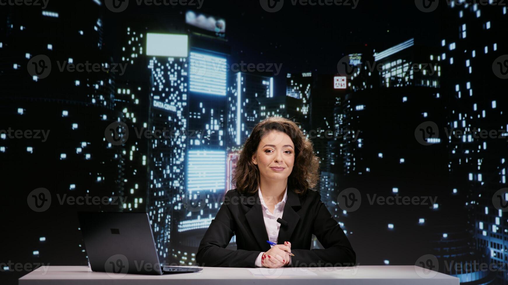 Journalist hosting live night show in newsroom, covering all entertainment topics and headlines. Woman reporter presenting newscast media segment on television, creating content for global network. photo