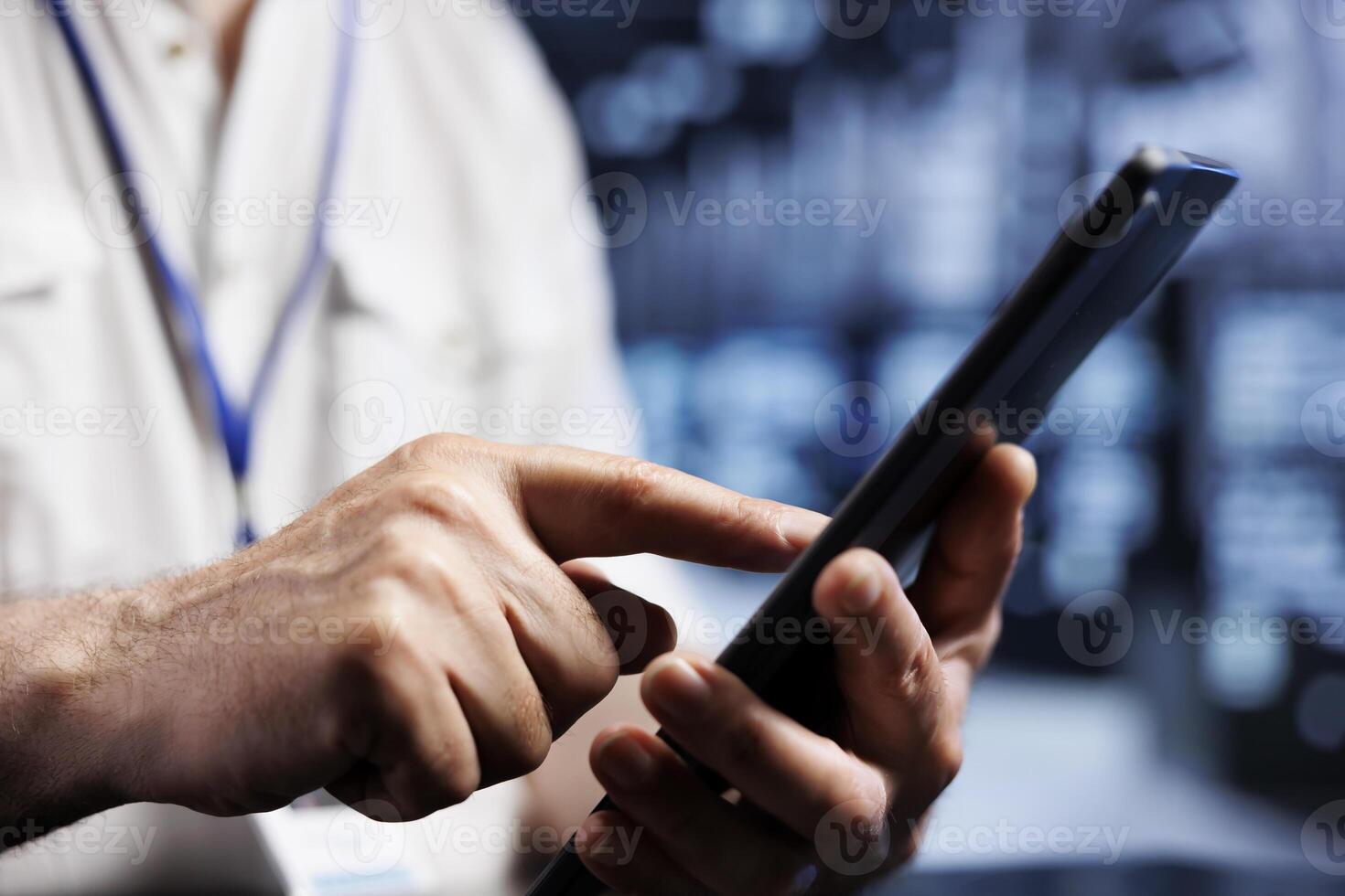 IT programmer using tablet in high tech establishment, installing dedicated VPN servers able to provide encrypted sensitive data, online anonymity and fast speed bandwidth to clients, close up photo