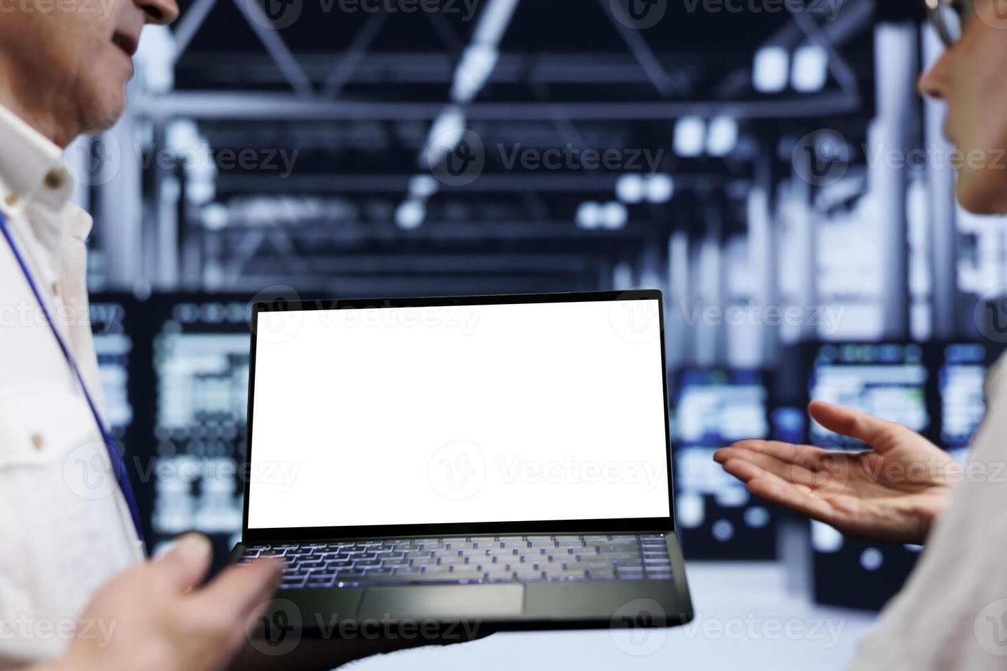 Close up shot of mock up laptop used by meticulous employee in cloud computing business server room delivering massive computational power, capable of processing and storing vast amounts of datasets photo