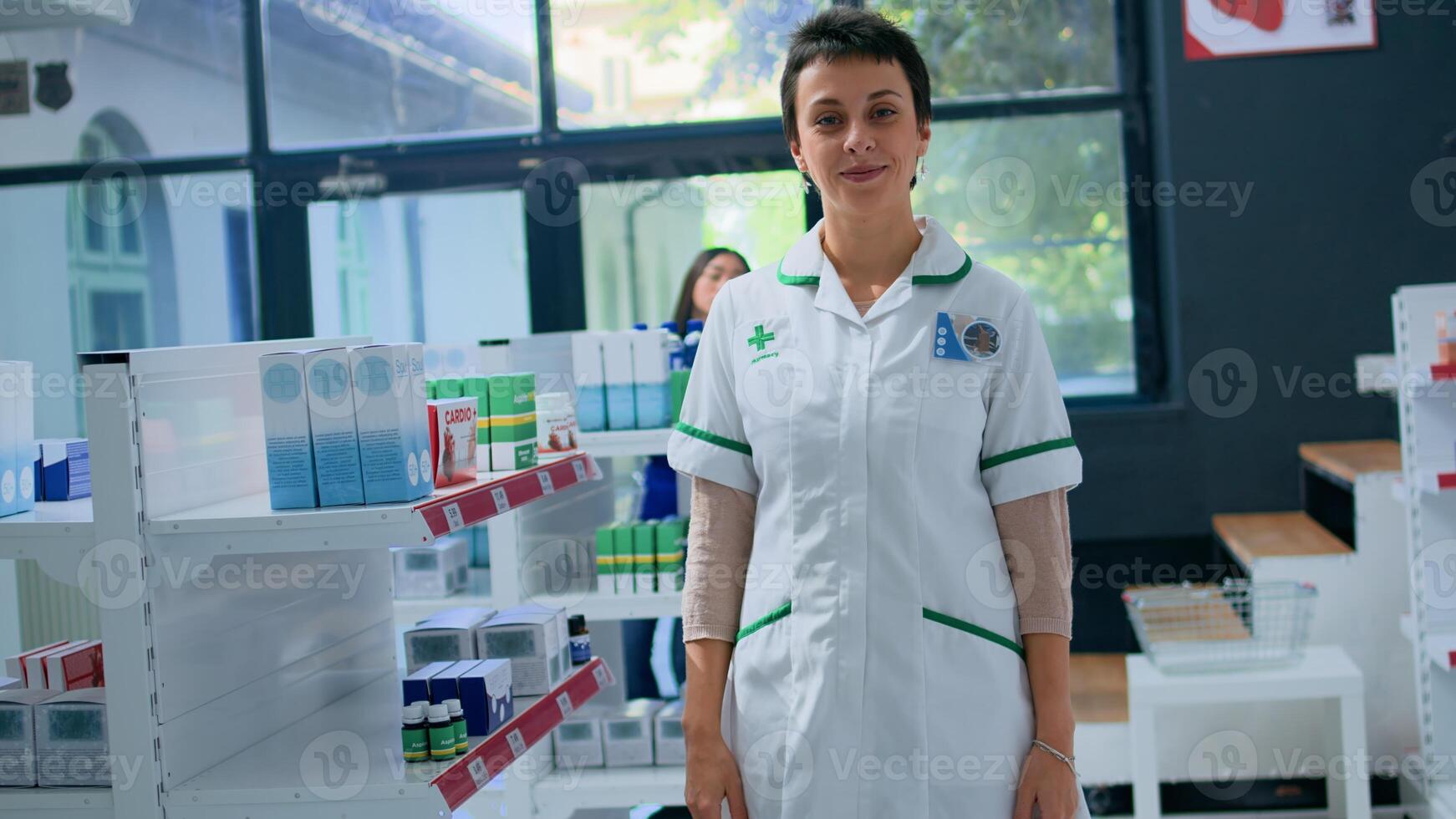 Portrait of friendly pharmacist in apothecary placing cardiovascular pills box on shelves. Smiling healthcare professional in drugstore arranging medicinal merchandise, ready to assist clients photo