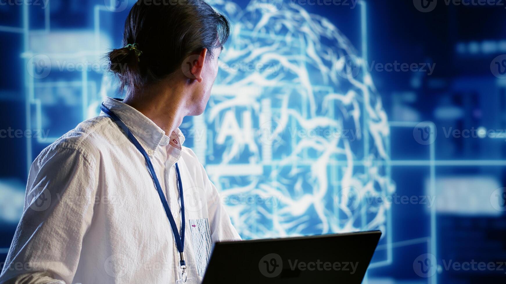 Asian specialist developing artificial intelligence neural networks architecture inspired by human brain. Certified programmer setting up AI machine learning algorithms in high tech startup photo