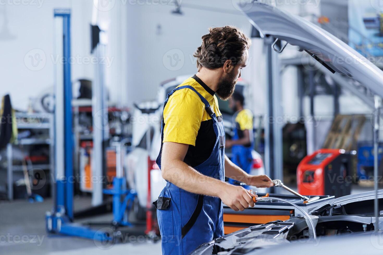 Qualified technician using oil extractor tool to change old