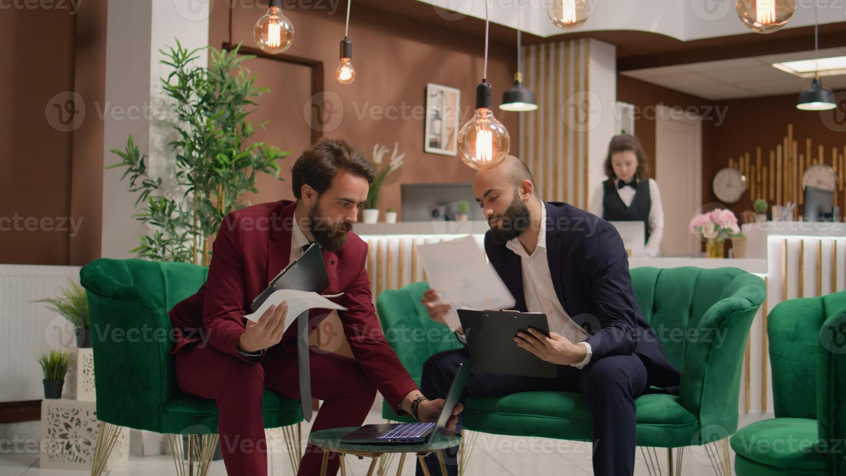 Businessmen collaborating at meeting, presenting different ideas to develop economic plan in lounge area. Corporate professionals engaging in discussions, strategizing project for future partnership. photo
