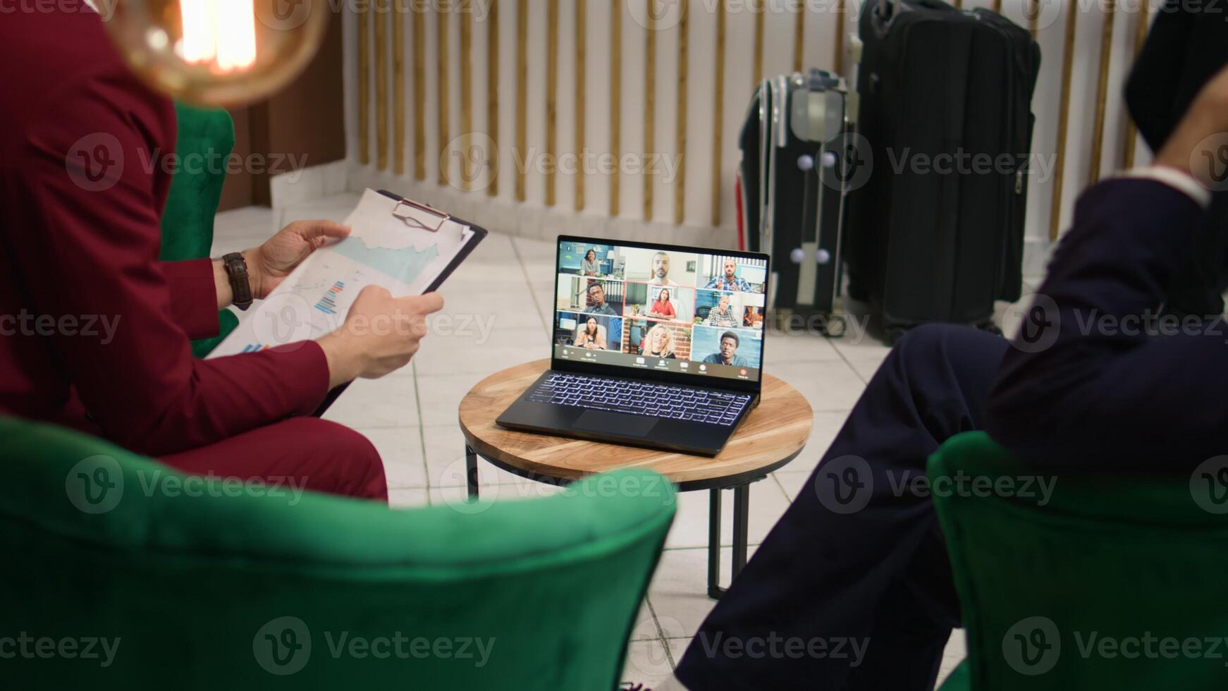 Businessmen presents ideas on videocall, using online telework meeting with investors or shareholders to develop management plan. Startup team attends remote conference on laptop. Handheld shot. photo