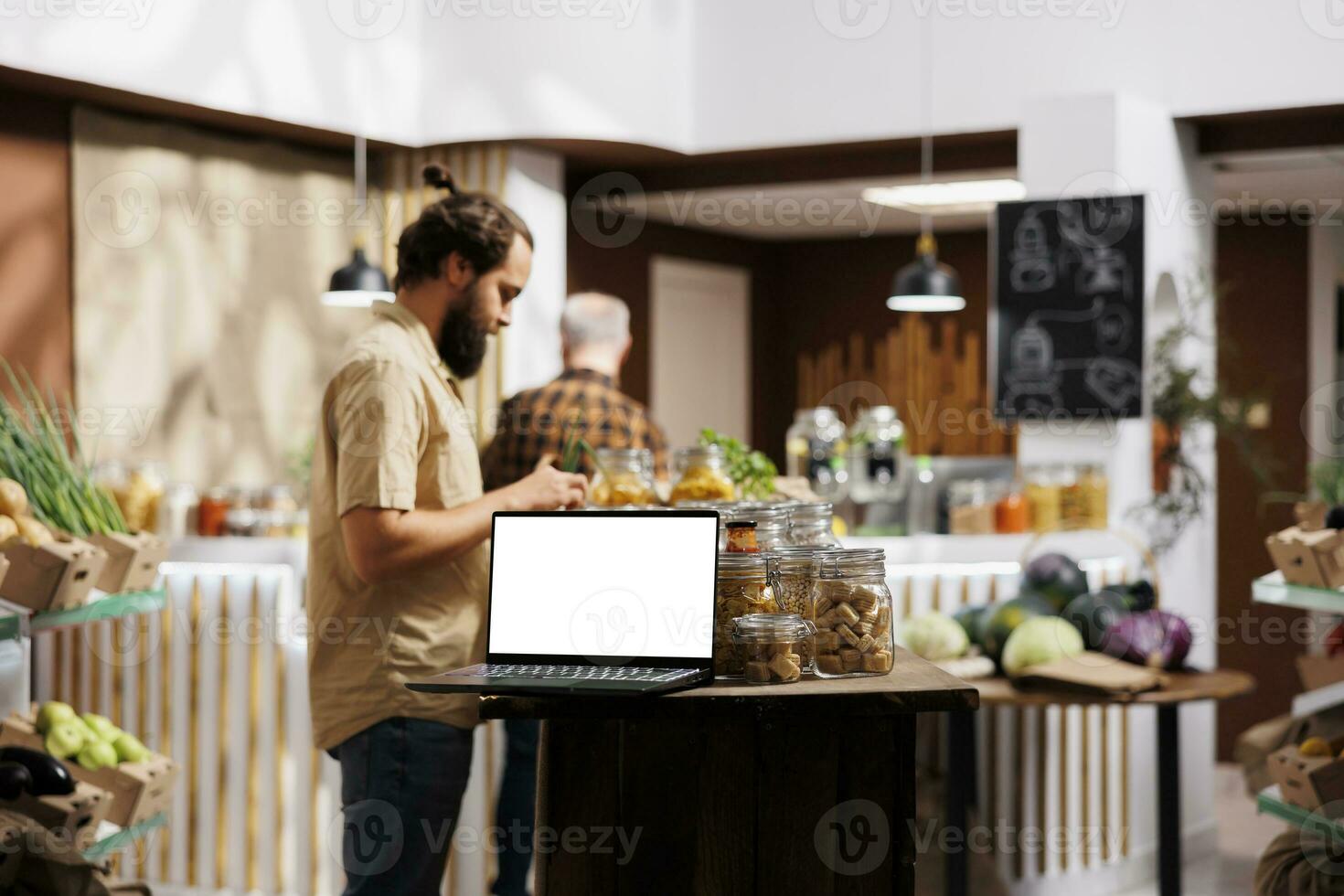 Mockup tablet with empty copy space used as advertising sign in environmentally friendly zero waste supermarket. Isolated screen device in pesticides free products store acting as promotional message photo