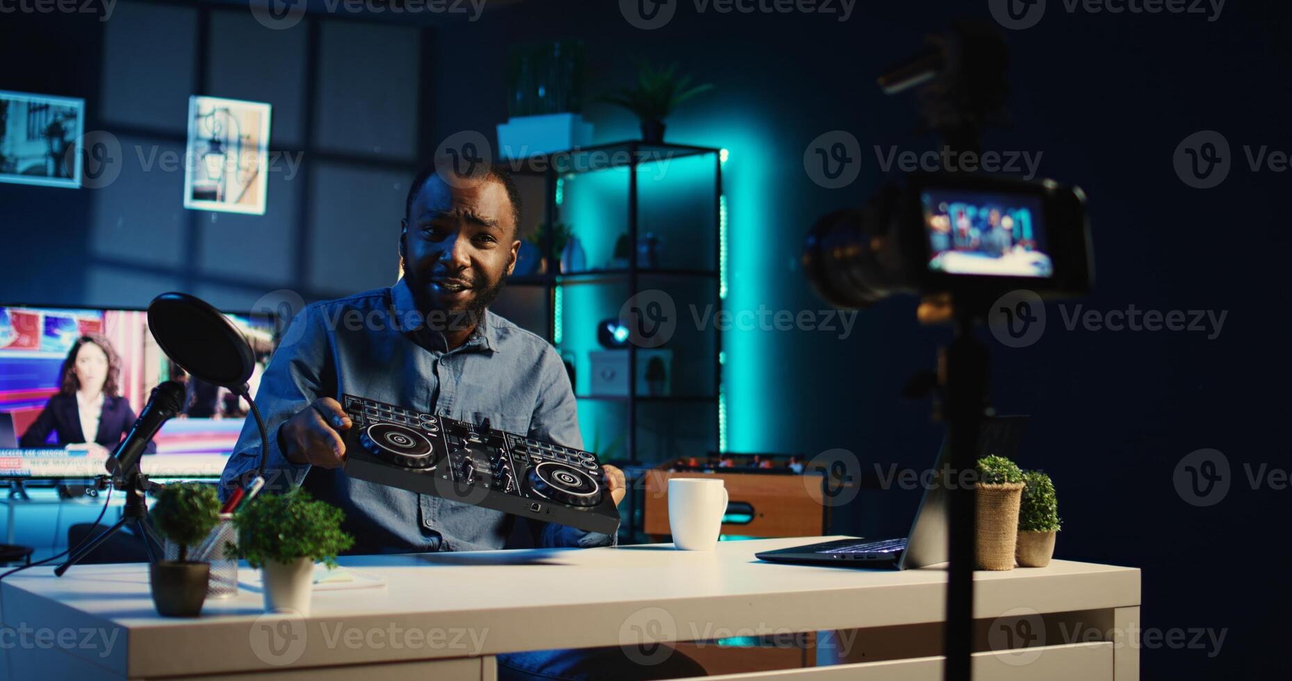 Content creator filming technology review of newly released high tech DJ controller, unboxing it and presenting specifications to audience. Influencer showing modern musical equipment to followers photo