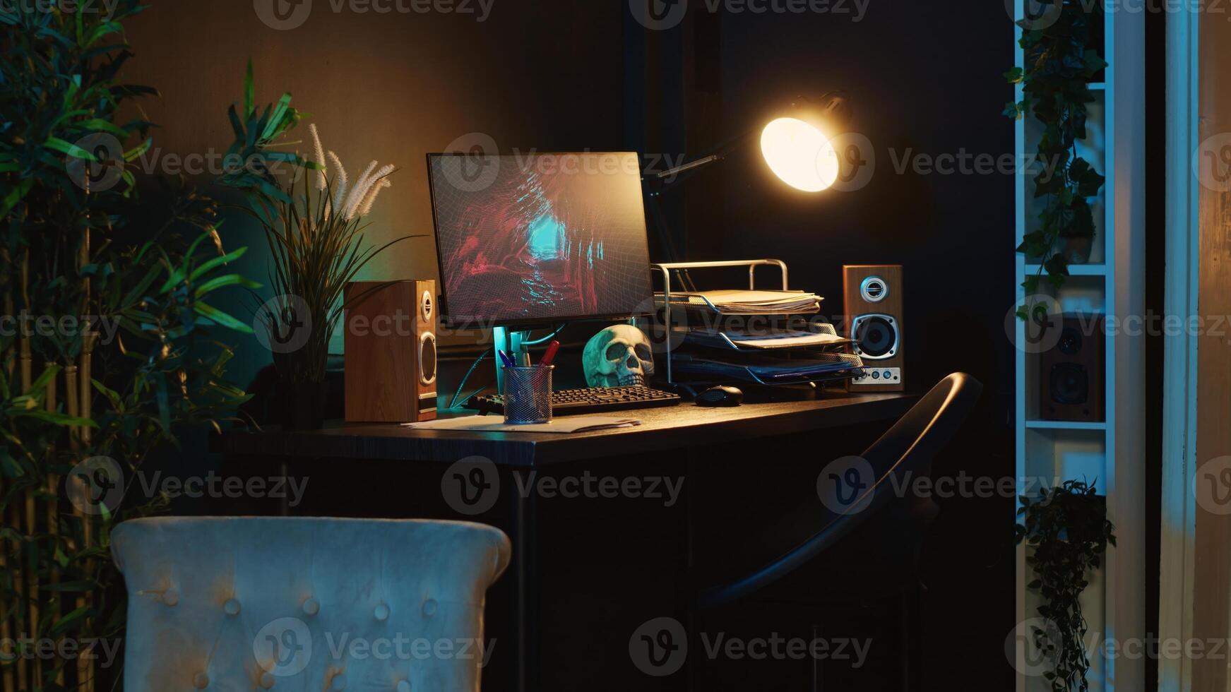 Close up shot of computer screens showing running animation rendering in dimly lit empty home interior. Zoom in on 3D renders on digital displays in cozy apartment living room photo