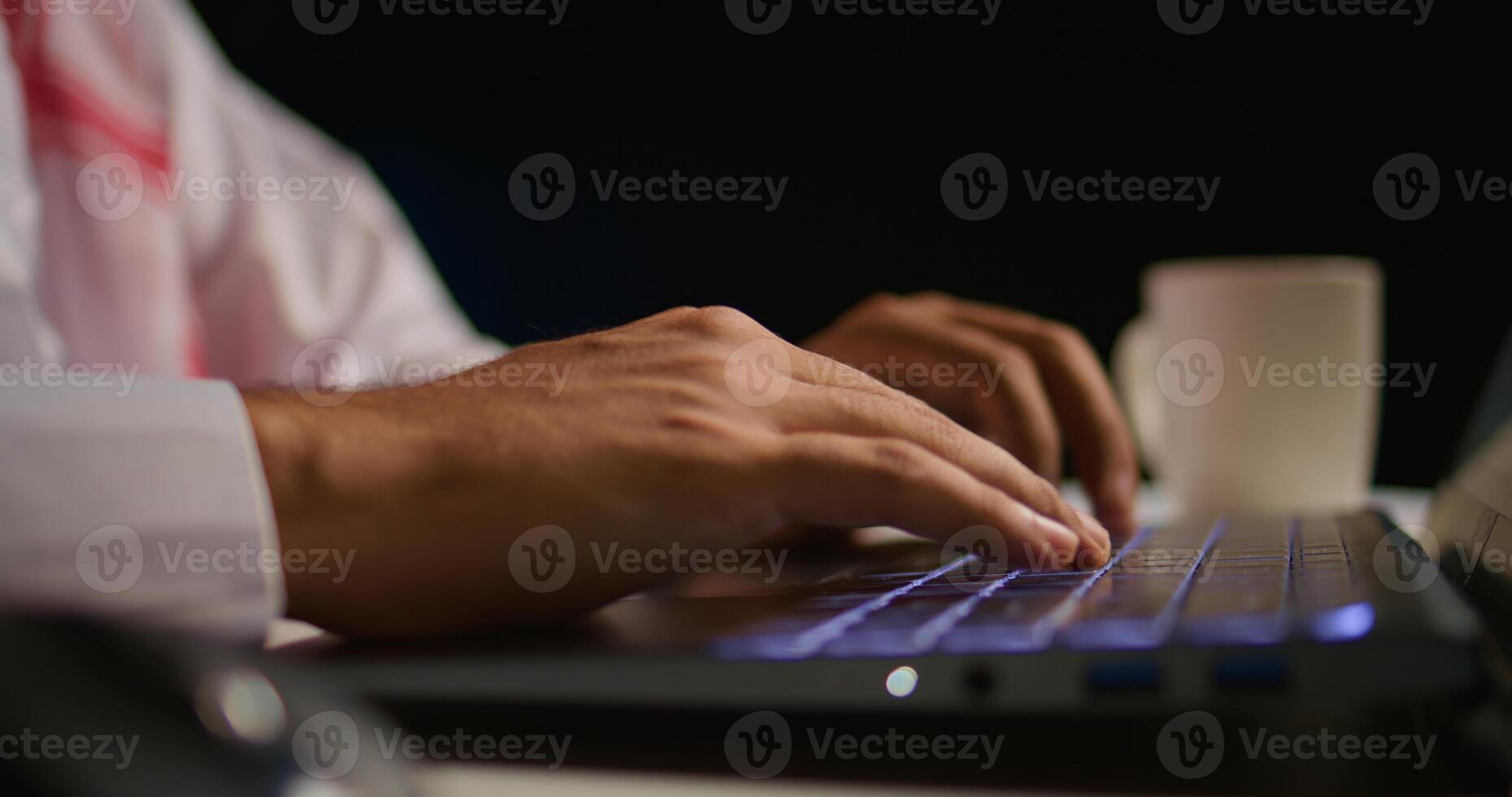 Close up shot of businessman using laptop keyboard and touchpad in office to send emails. Business executive typing on notebook, composing documents in order to deliver finalized project paperwork photo