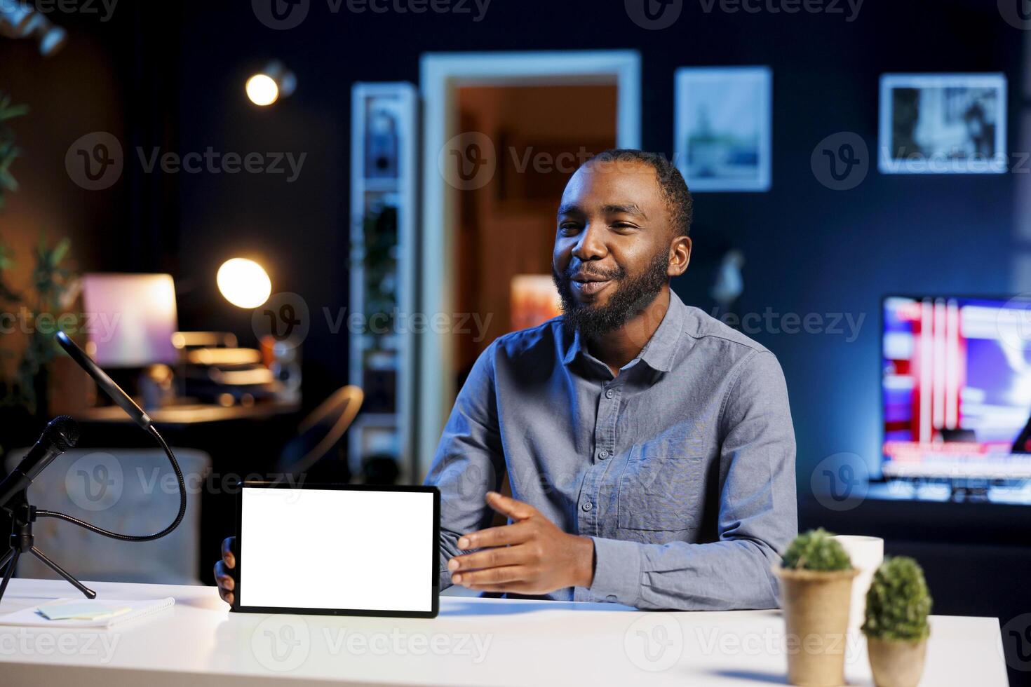 Man filming tech tutorial on how to repair broken mockup tablet, presenting internal parts. Technology internet show host teaching subscribers how to open and fix isolated screen digital device photo